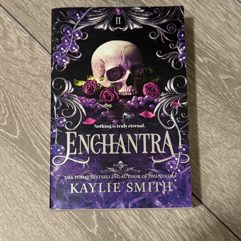 Enchantra Book with Skull and Roses Cover